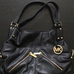 Black Michael Kors bag with gold details